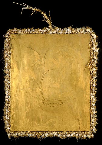 shallow relief of the sculpture Thalia in gold encaustic on panel framed with braided garlic