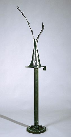 figurative sculpture in steel evoking column dress 